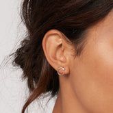 14k Yellow Gold Diamond Bezel Door Knocker Earrings on woman's ear